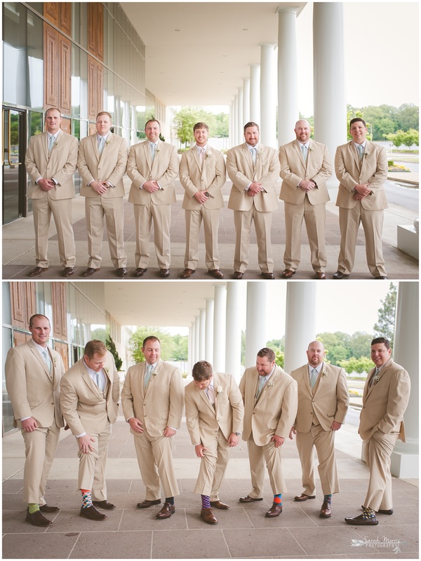 Groom and Groomsmen, wearing khaki suits under the portico at Bellevue Baptist Church