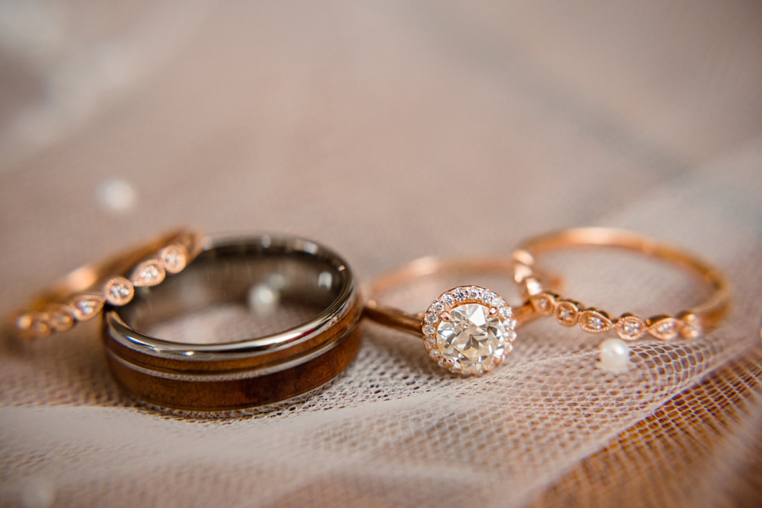 Wedding rings on wedding veil at Avon Acres
