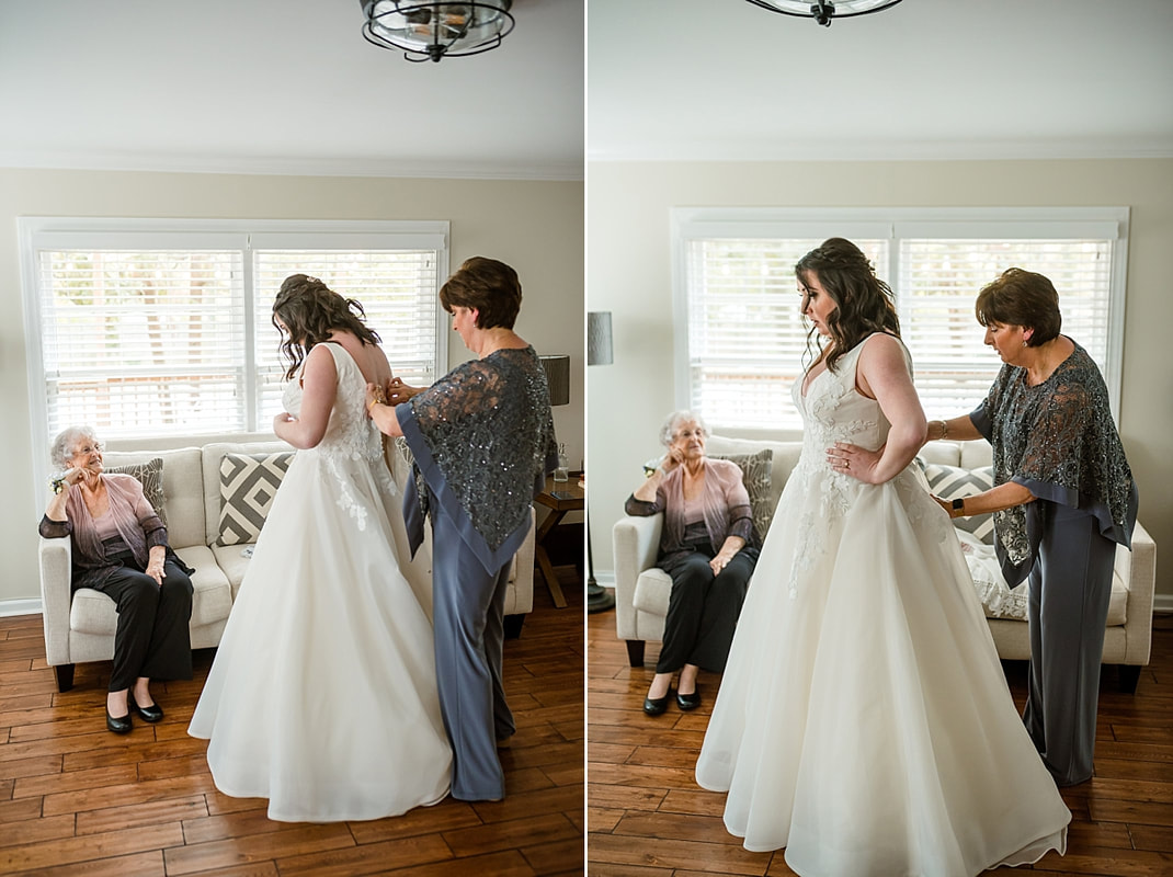 Mother of the Bride helping bride get dressed at Avon Acres