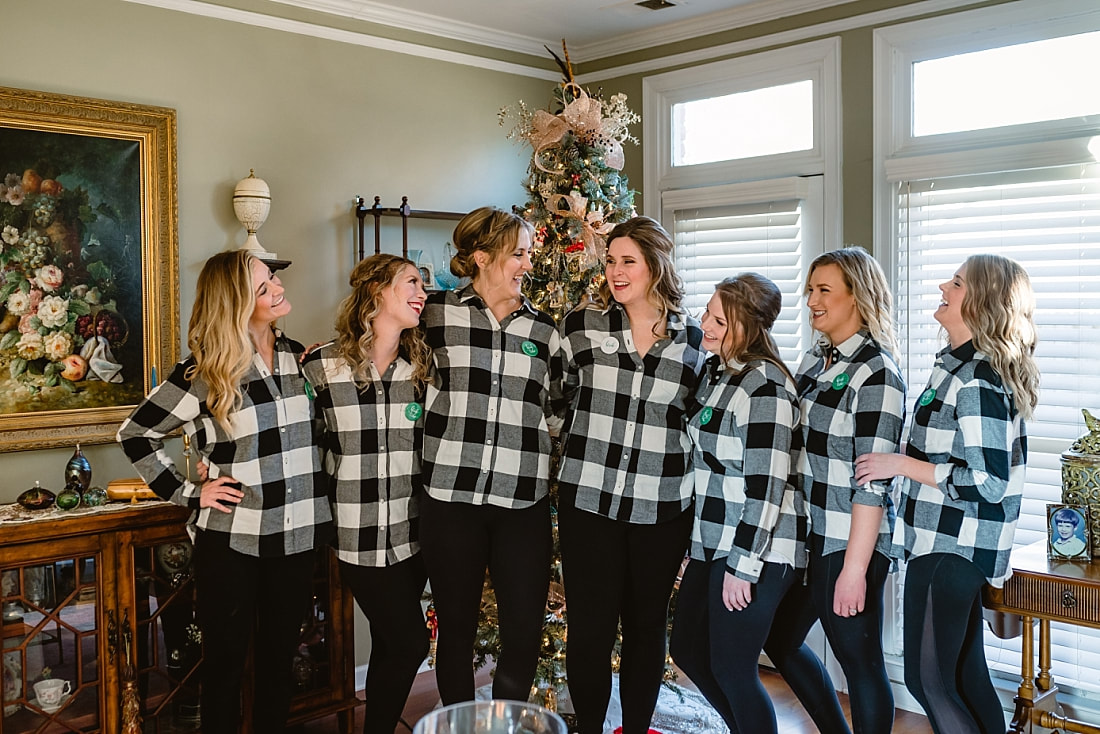 Bride with her bridesmaids in matching buffalo plaid flannel shirts in Collierville, TN