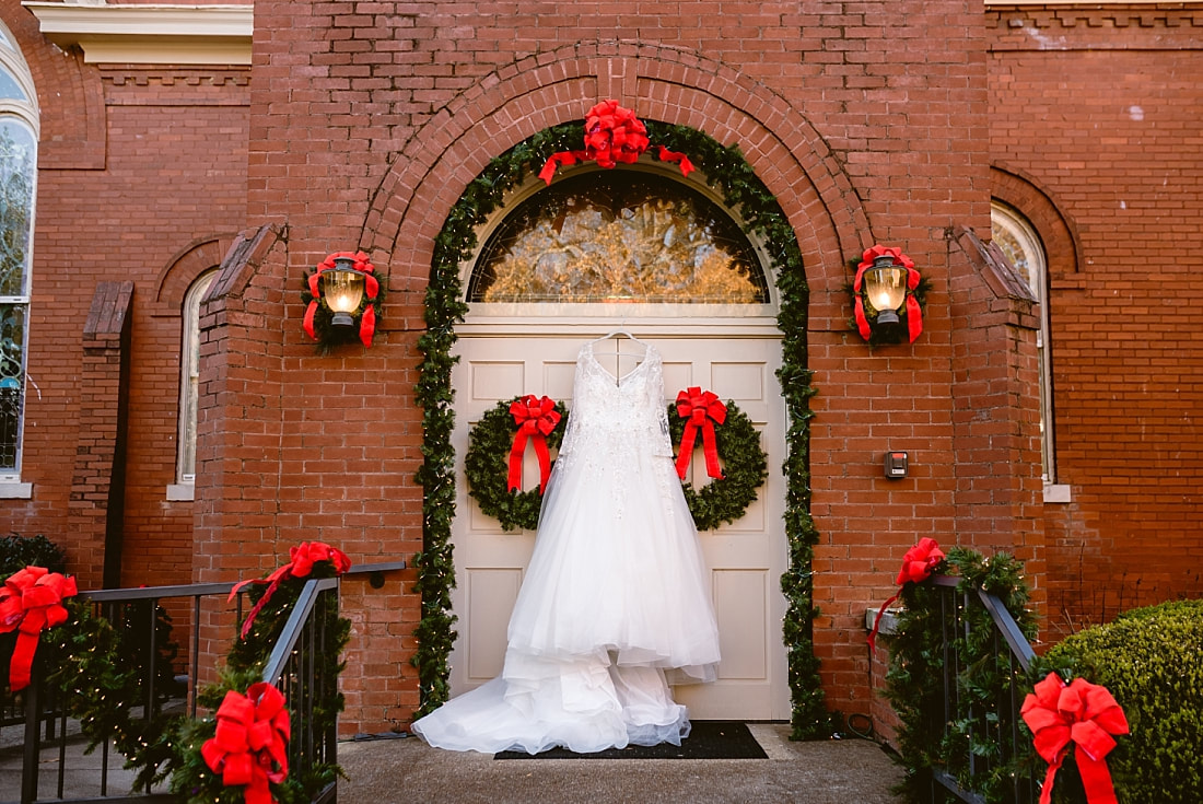 Wedding gown hanging on the doors of CUMC Town Square in Collierville, TN