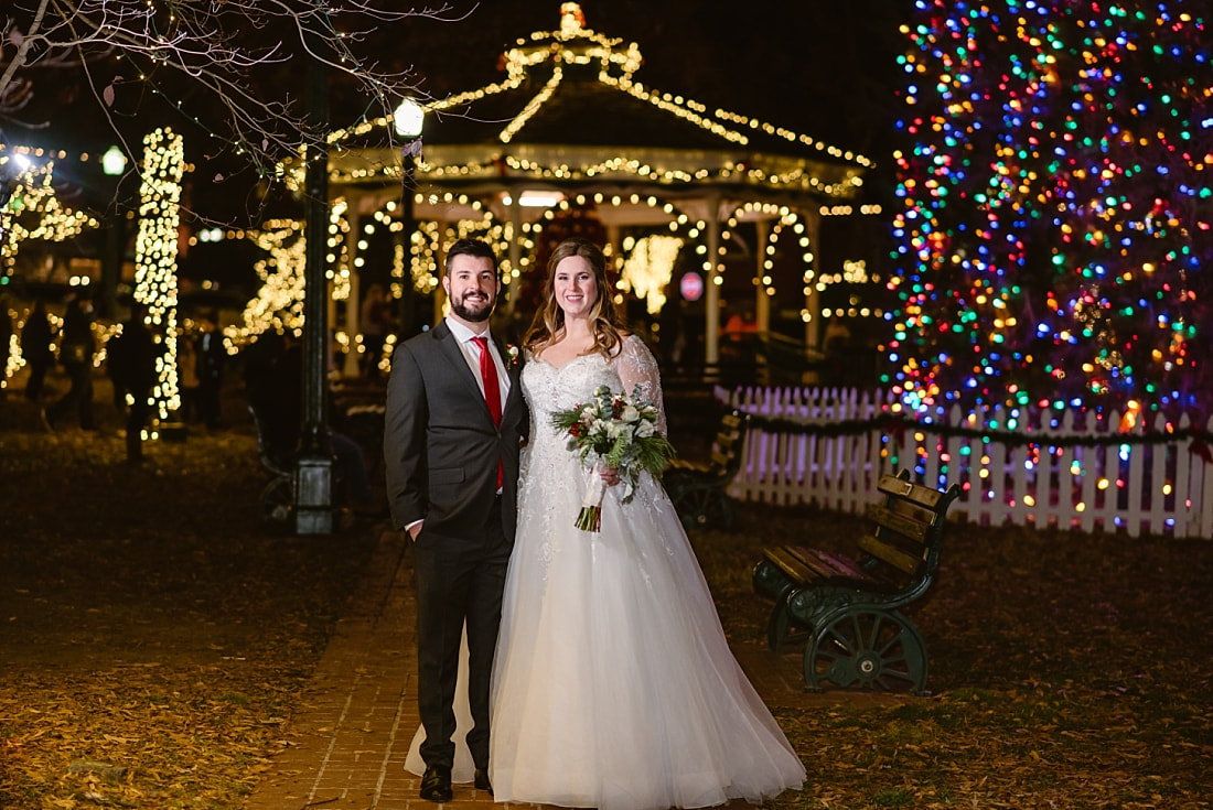 Bride and Groom at the Collierville Town Square in front of the Christmas lights for Christmas wedding portraits