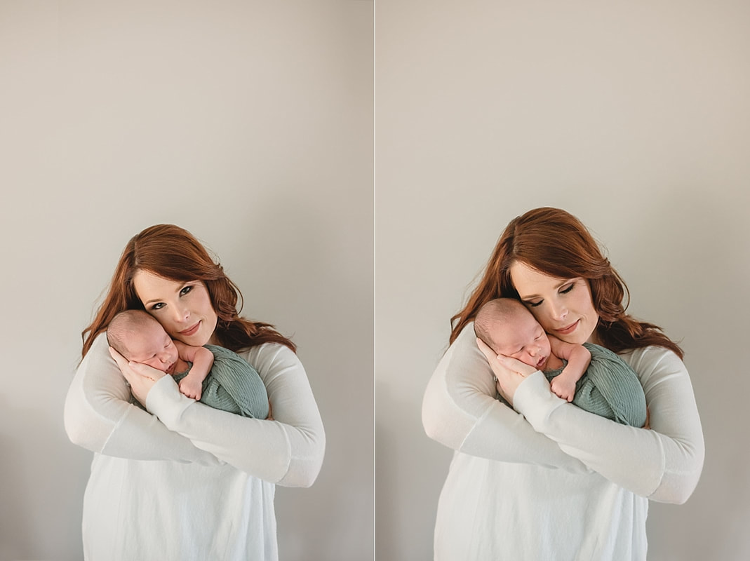 mother hold newborn baby boy for newborn portraits in memphis tn