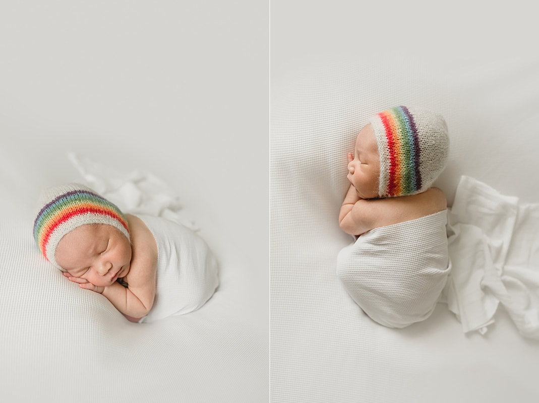 rainbow baby boy wearing rainbow bonnet for newborn photo shoot in memphis