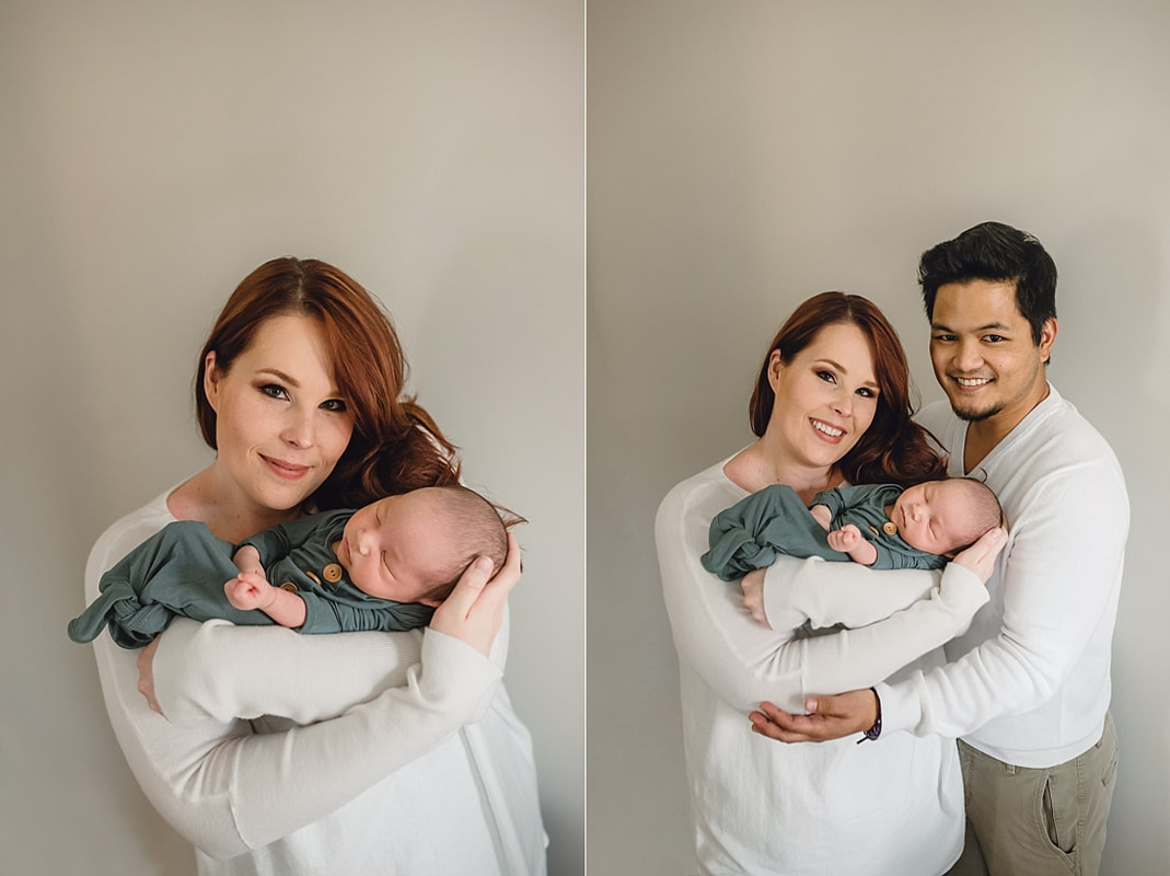 new family of three, mom and dad holding newborn baby boy during newborn photos in memphis, tn