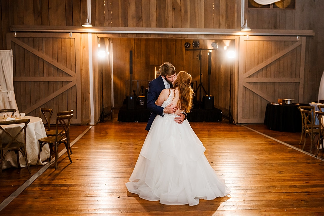 bride and groom kissing during last dance of the wedding reception at Spring Creek Ranch in Collierville, TN
