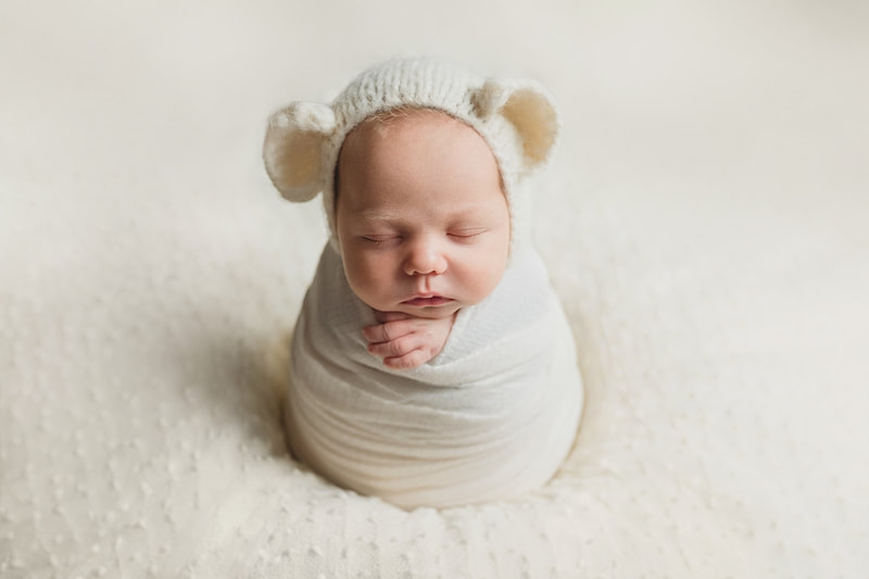Baby Boy dressed up as teddy bear during newborn photo session with Sarah Morris Photography