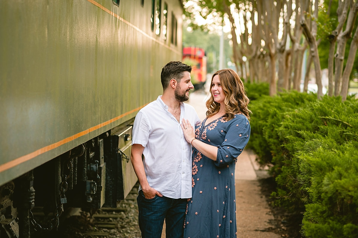 engagement photos by the trains at collierville town square