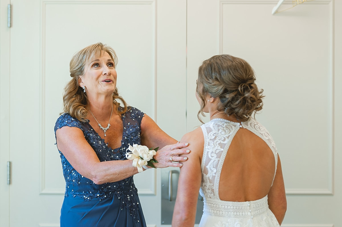 bride's mother seeing her beautiful daughter as a bride for the first time