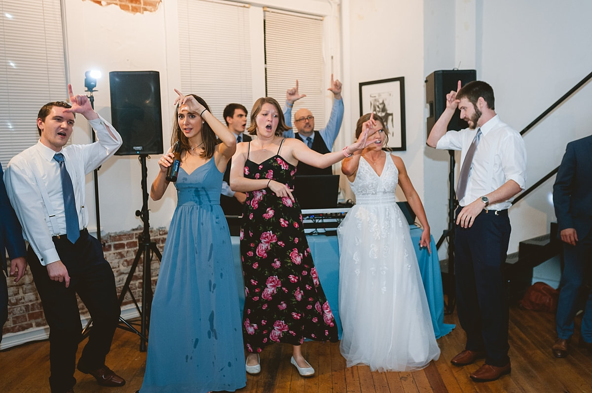 bride dancing with her friends at the robinson gallery downtown memphis