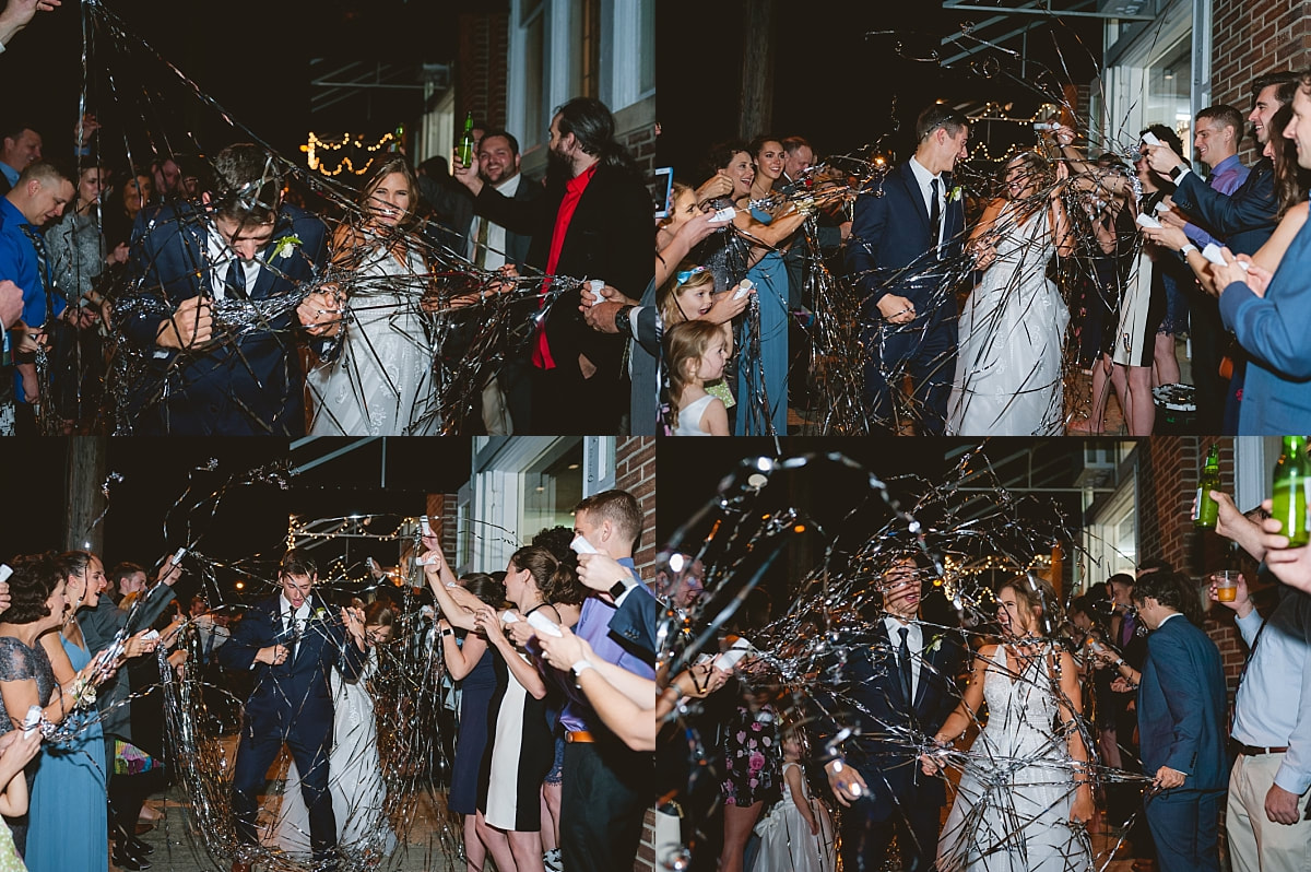 bride and groom exiting their wedding reception as wedding guests shoot confetti at them at the robinson gallery downtown memphis
