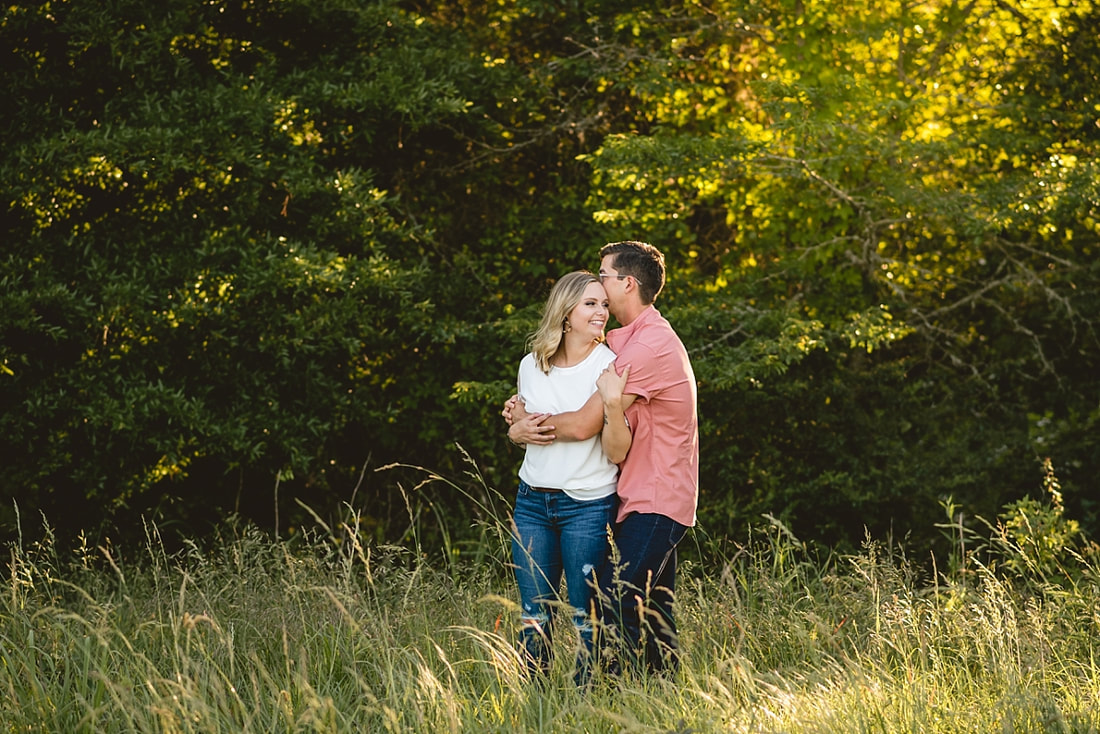 couple posing for engagement photos at shelby farms park in memphis, tn
