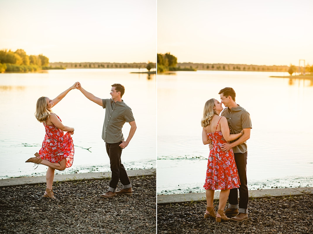 couple posing for engagement photos by the lake at shelby farms park in memphis, tn