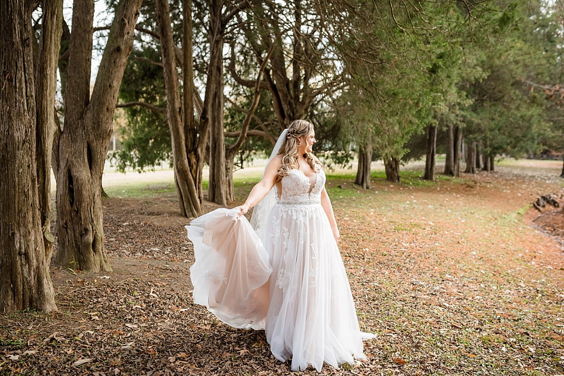 Bride twirling her wedding dress at Green Frog Farm with Sarah Morris Photography