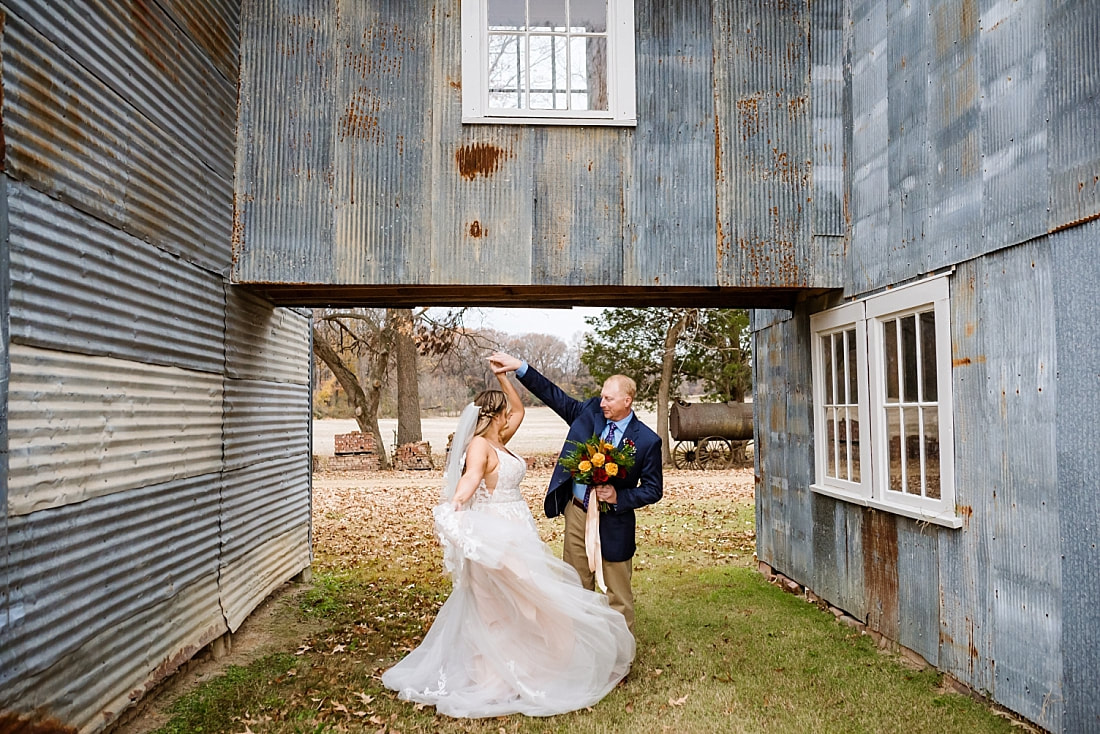 bride and groom dancing outside the old cotton gin at Green Frog Farm