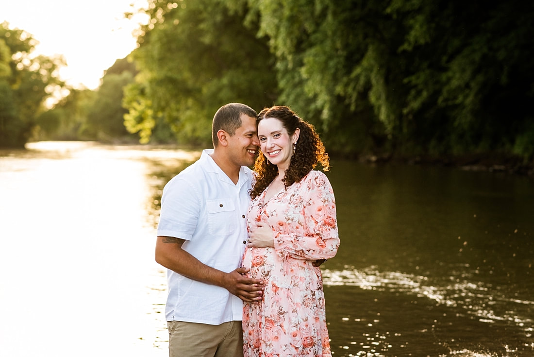 Portrait of father with pregnant mother at the creek in Memphis, TN