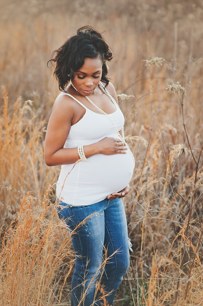 pregnant mother glowing at maternity photo session at nonconnah greenbelt