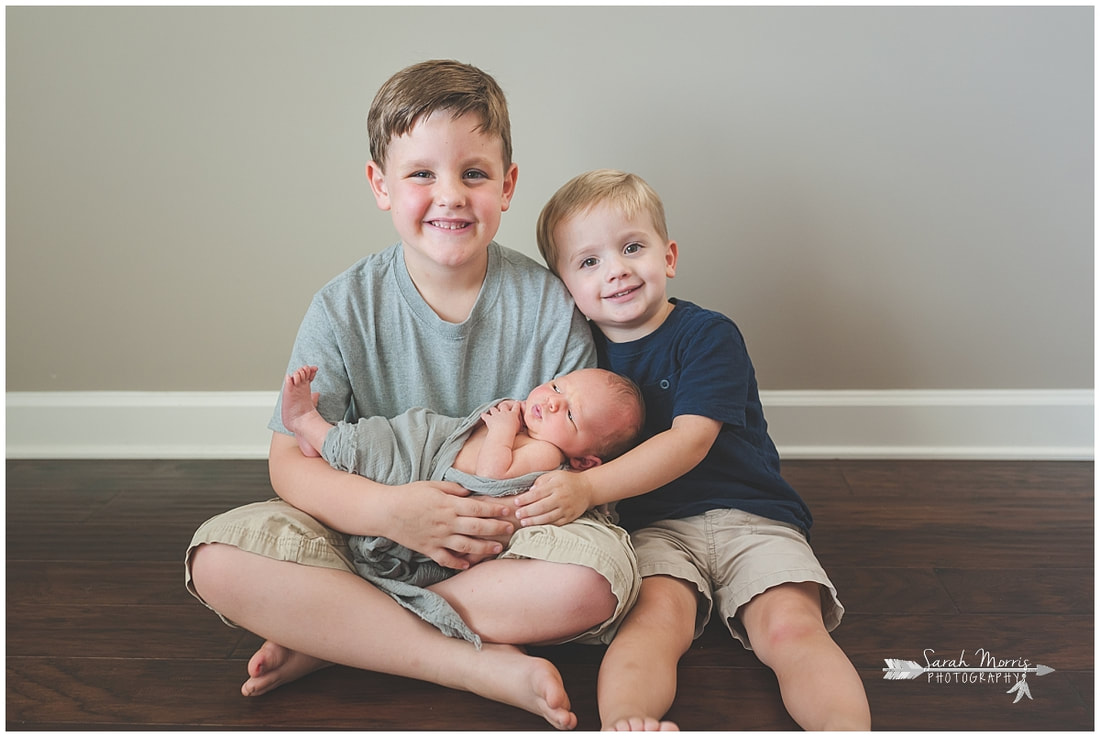 Newborn photos with older siblings