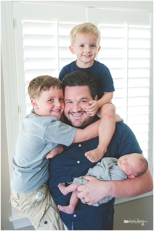 Newborn photos with dad and older siblings, Dad holding all three kids