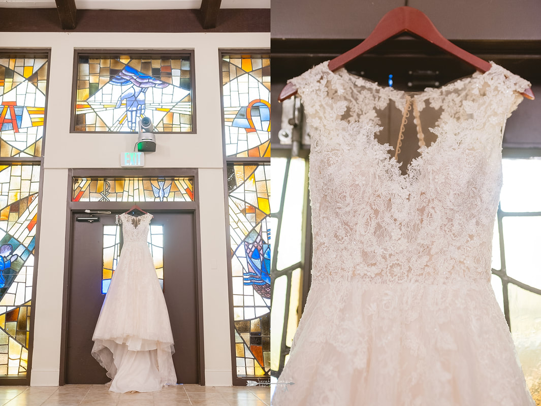 wedding dress hanging in front of stained glass windows at Overton Chapel, Memphis Wedding Photographer