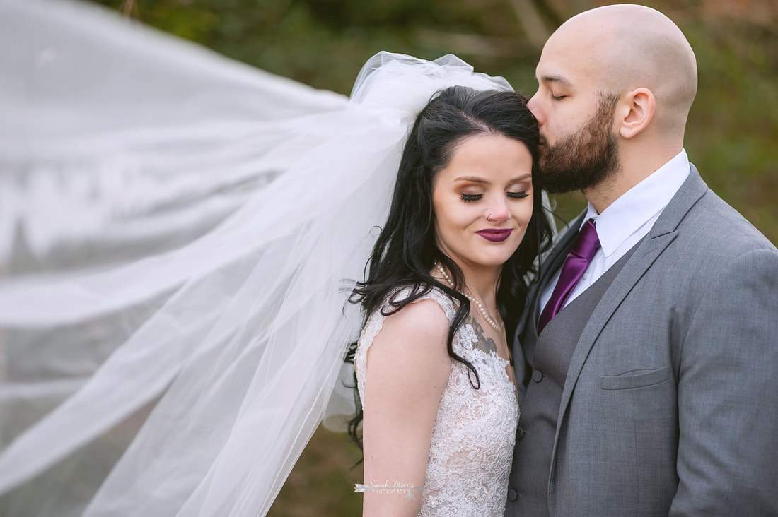 Groom kissing bride's forehead at Overton Chapel, Memphis Wedding Photographer