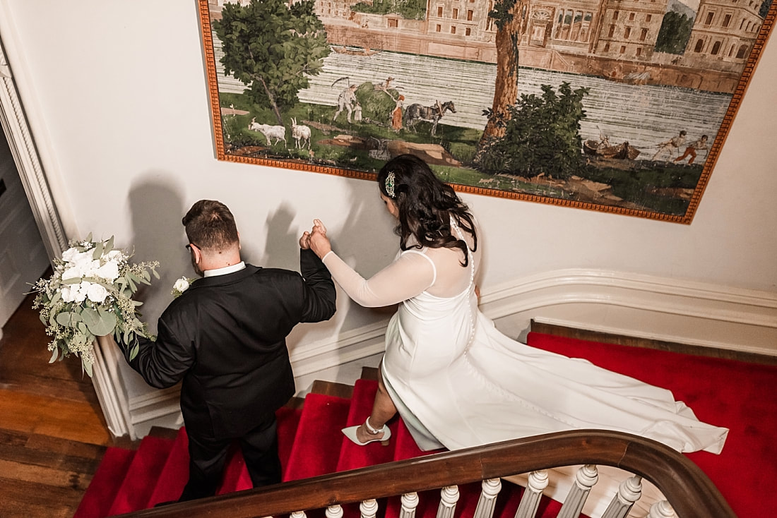 bride and groom walking down stairs + Wedding at Woodruff-Fontaine in Memphis, TN