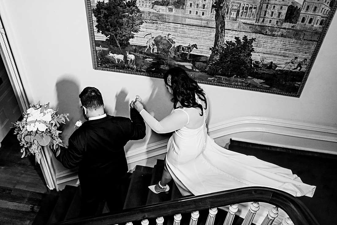 bride and groom walking down stairs + Wedding at Woodruff-Fontaine in Memphis, TN