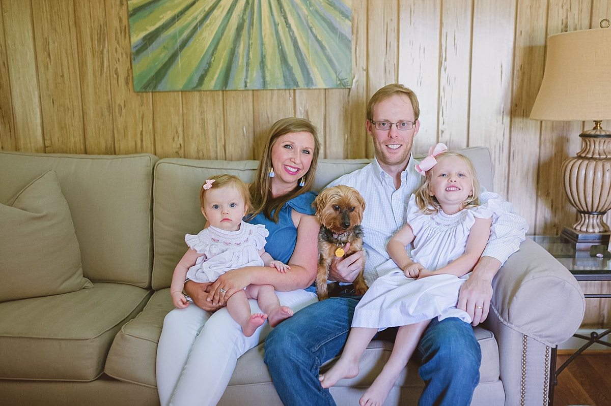 family portrait on the couch during in home lifestyle family session in collierville, tn