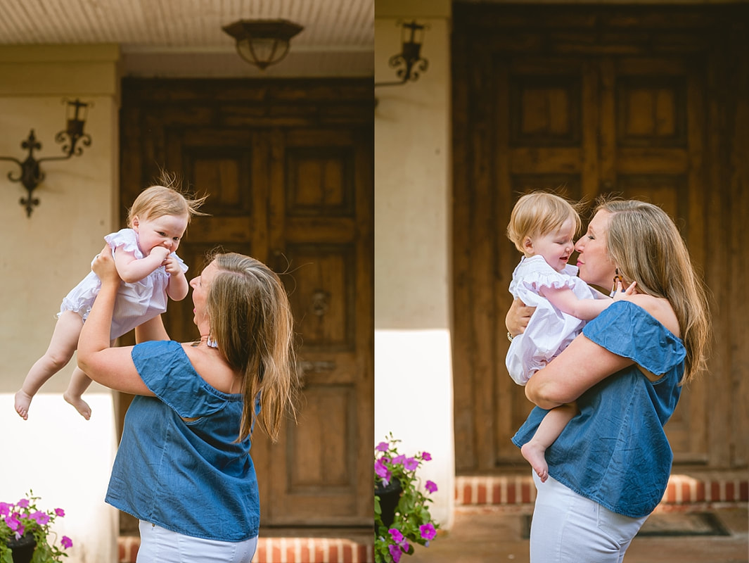 mother snuggling her baby girl on the front porch during in home lifestyle family session in collierville, tn