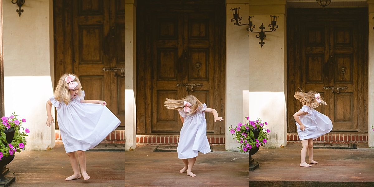 little girl twirling her dress during in home lifestyle family session in collierville, tn