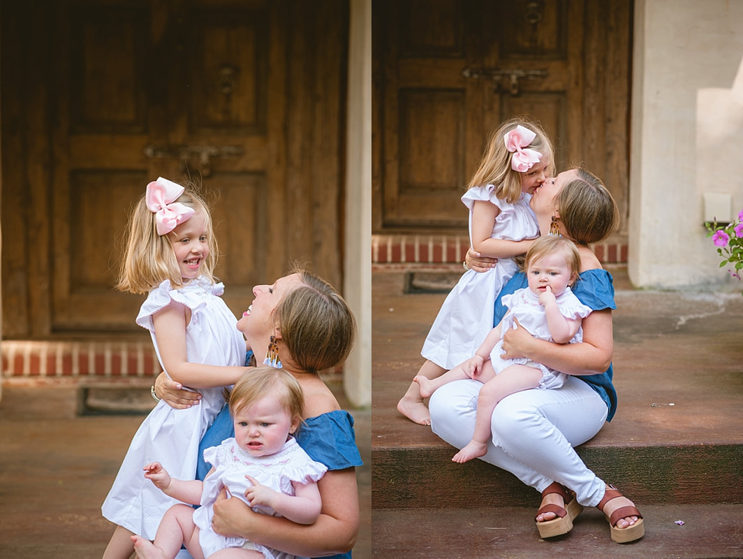 mother snuggling her little girls during in home lifestyle family session in collierville, tn