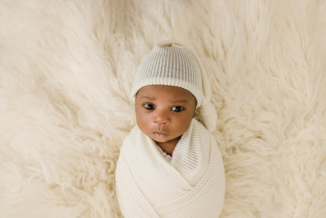 Baby Boy wrapped in cream blanket for newborn photos in Collierville TN with Sarah Morris photography