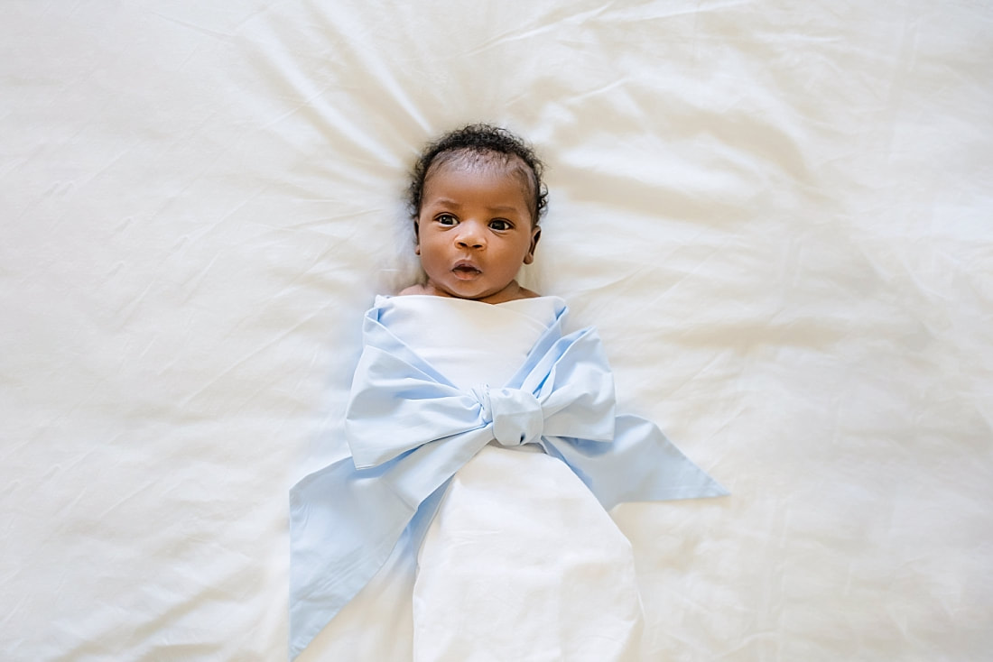 Baby boy wrapped in a Bow Swaddle by The Beaufort Bonnet Company for newborn photos in Collierville, TN