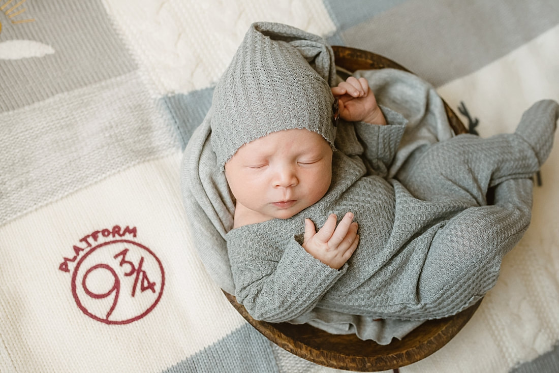 newborn on Harry Potter blanket for newborn photos in Memphis, TN