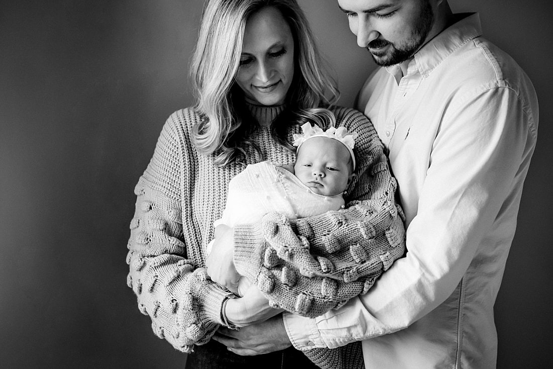 parents with newborn baby girl for newborn portraits in Memphis, TN