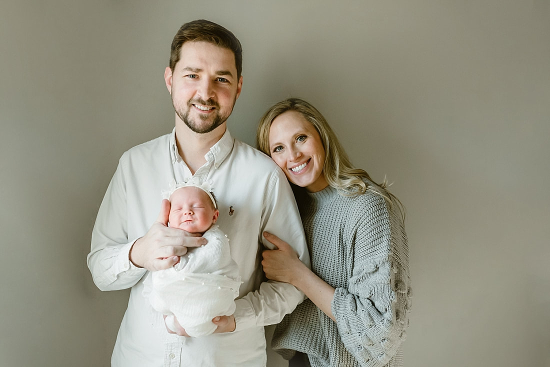 parents with newborn baby girl for newborn portraits in Memphis, TN
