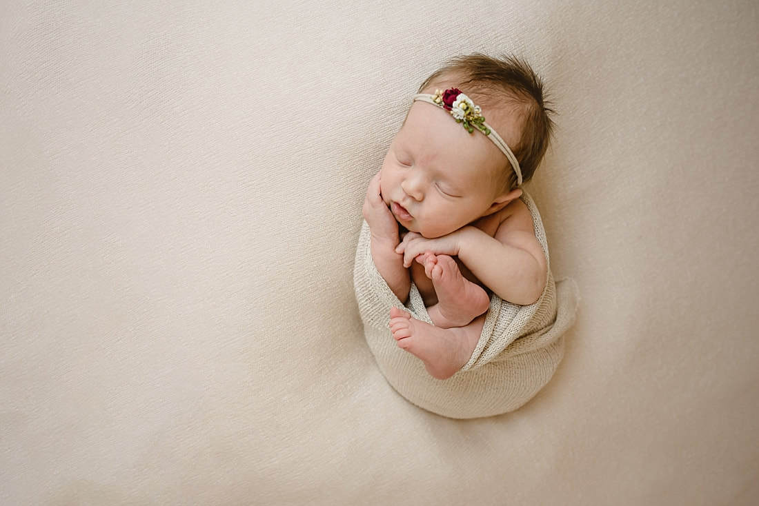 Baby girl swaddled for newborn portraits in Memphis, TN
