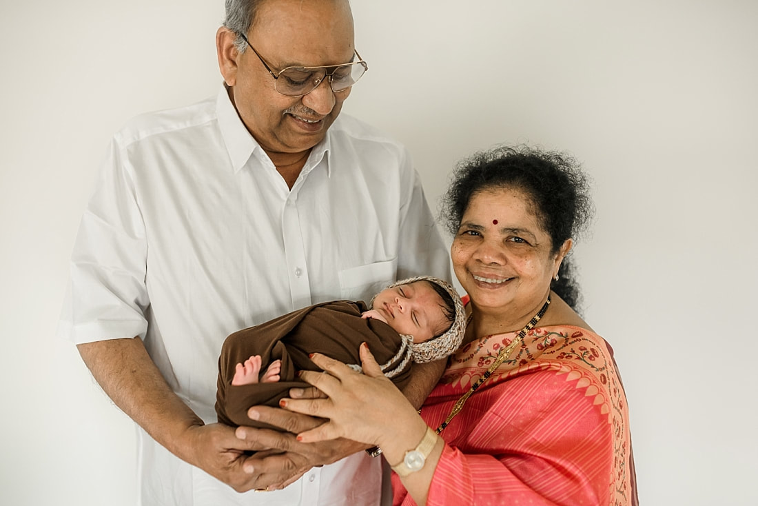 Indian grandparents with newborn grandson