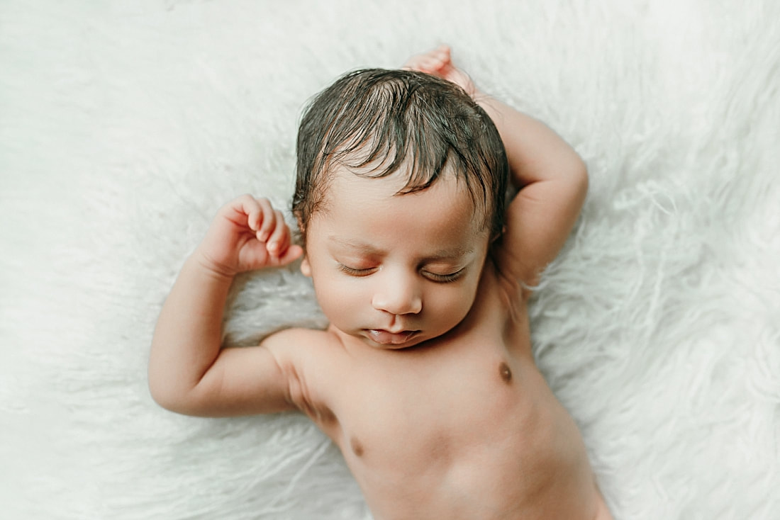 newborn baby boy sleeping on white blanket in Memphis, TN