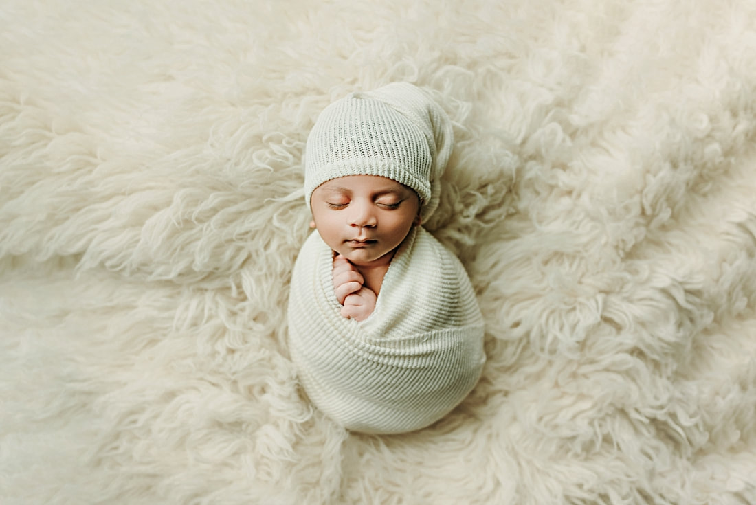 Newborn baby boy swaddled for newborn portrait in Memphis, TN