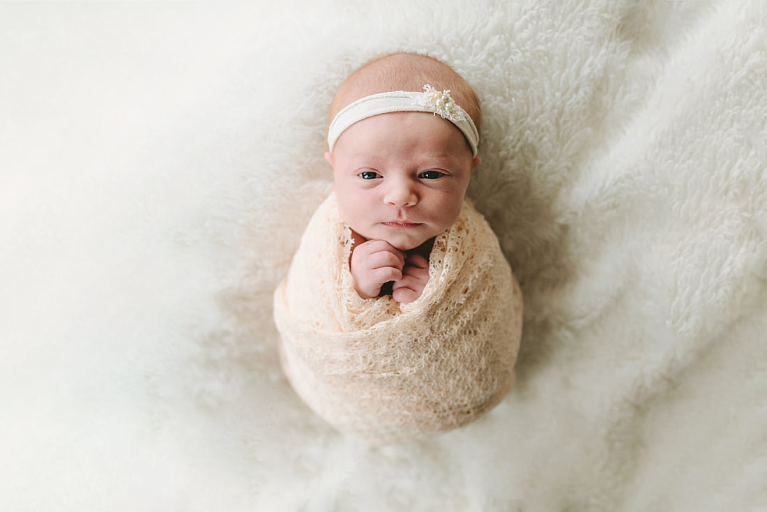 newborn baby swaddled for newborn photoshoot in Memphis, TN