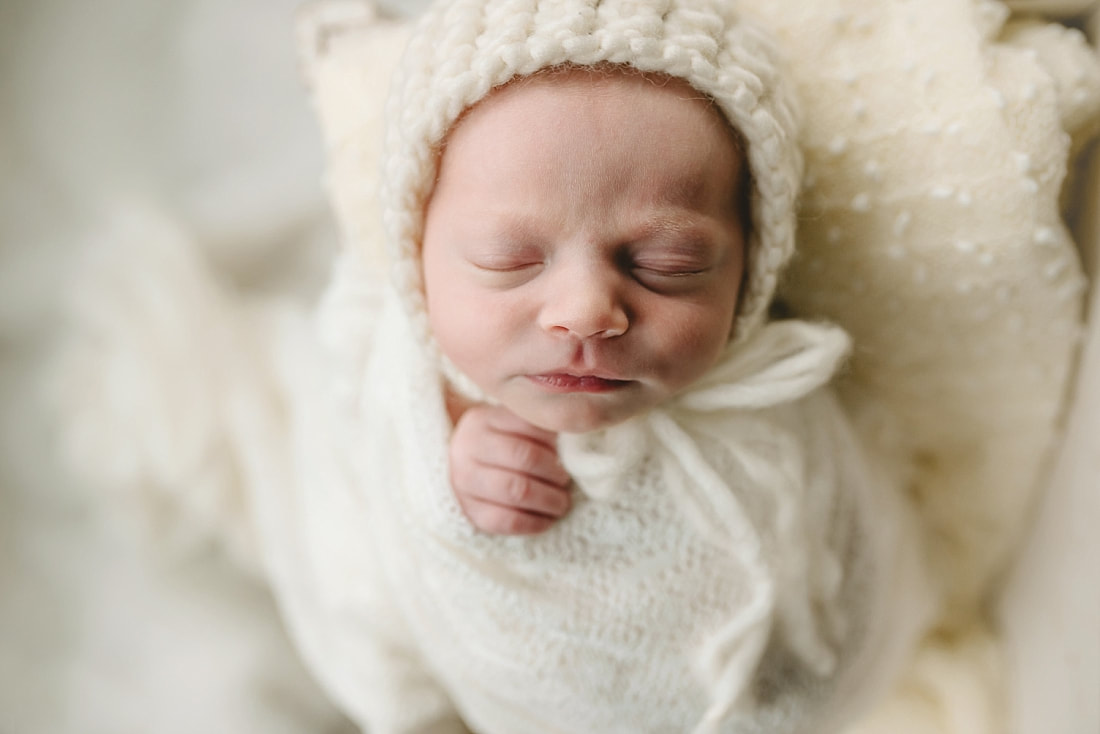 newborn baby swaddled for newborn photoshoot in Memphis, TN