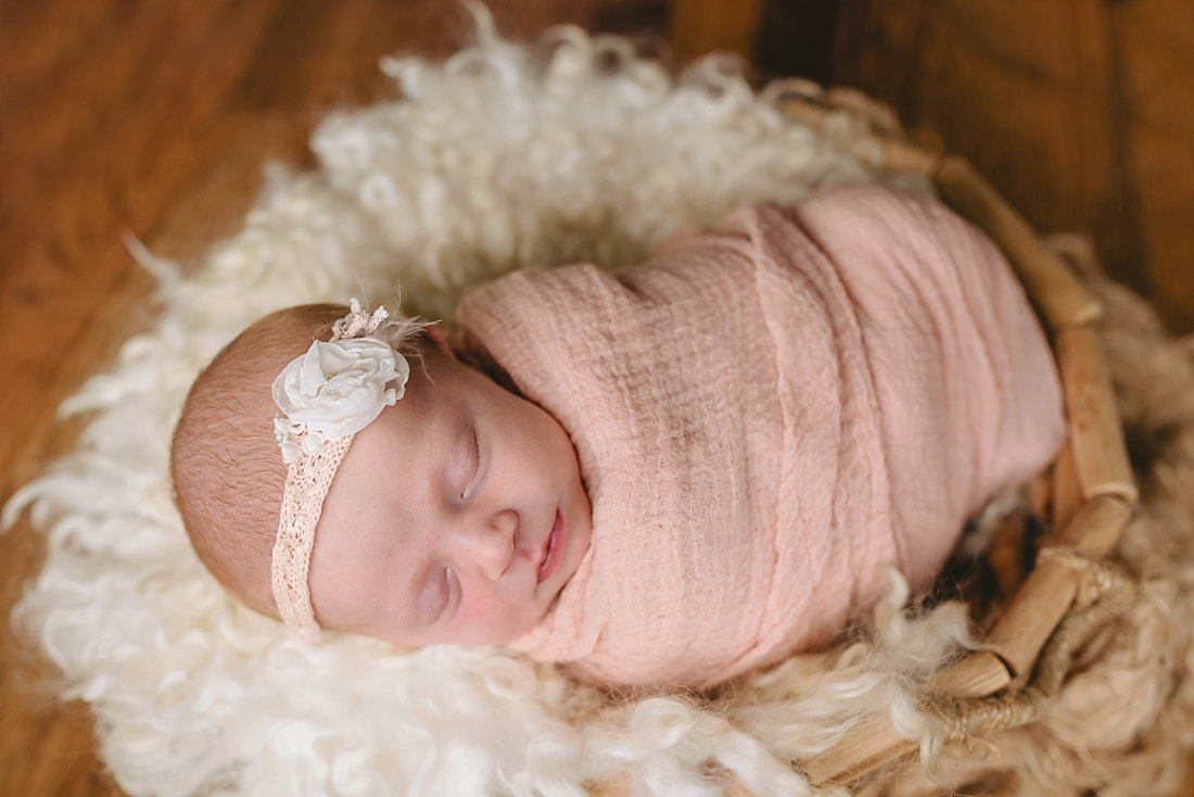 newborn baby swaddled for newborn portraits in Memphis