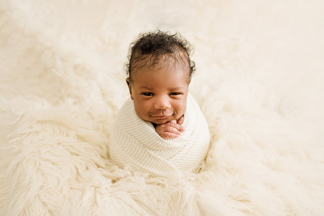 Baby Boy wrapped in cream blanket for newborn photos with Sarah Morris photography