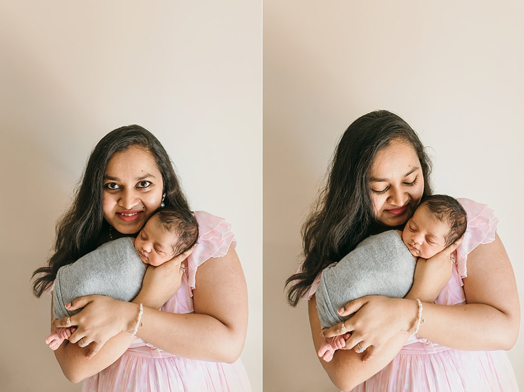 mother holding newborn baby boy for newborn photos in memphis