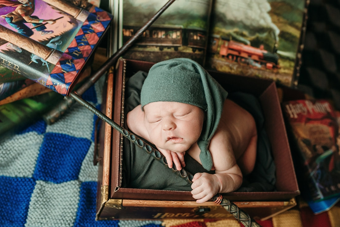 newborn baby boy posed in a Harry Potter scene in Memphis, TN
