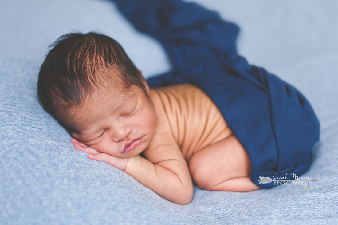newborn photo of baby boy sleeping on blue blanket