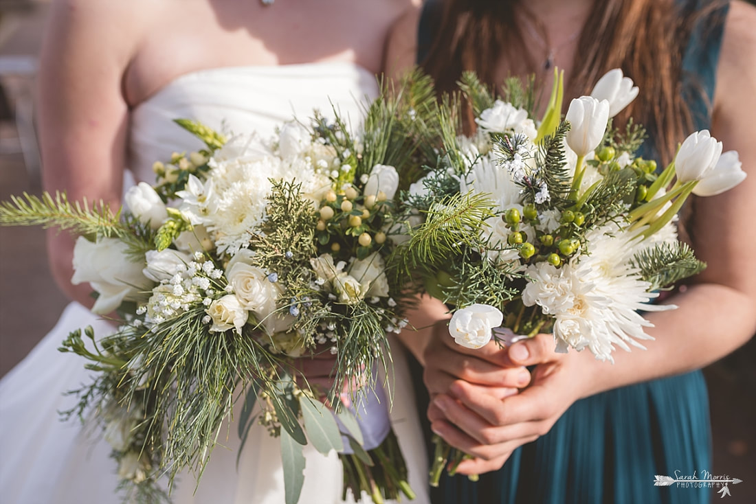 close up of bride's and bridesmaid's winter bouquets by rachel's flowers