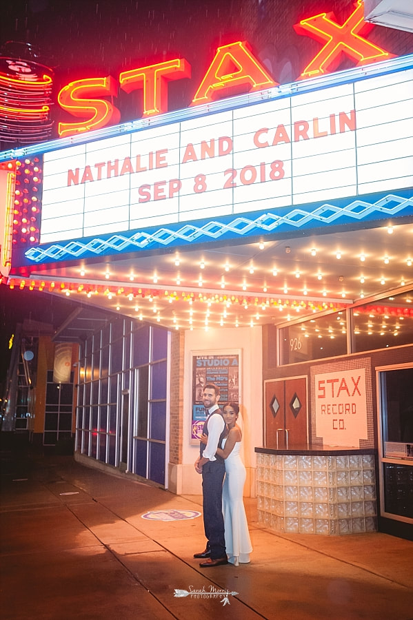 Bride and groom posing under the Marquee at the Stax Museum