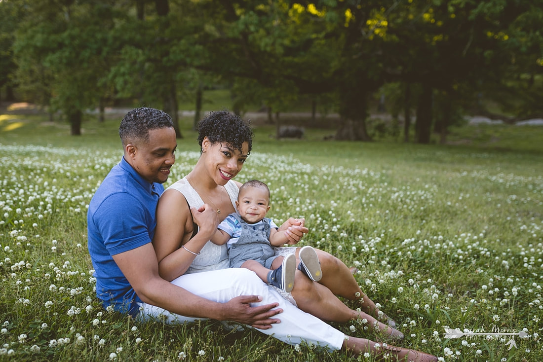 Family pictures in a field of clover at Shelby Farms Park